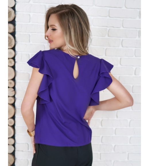 Фіолетова блуза з вирізами і воланами