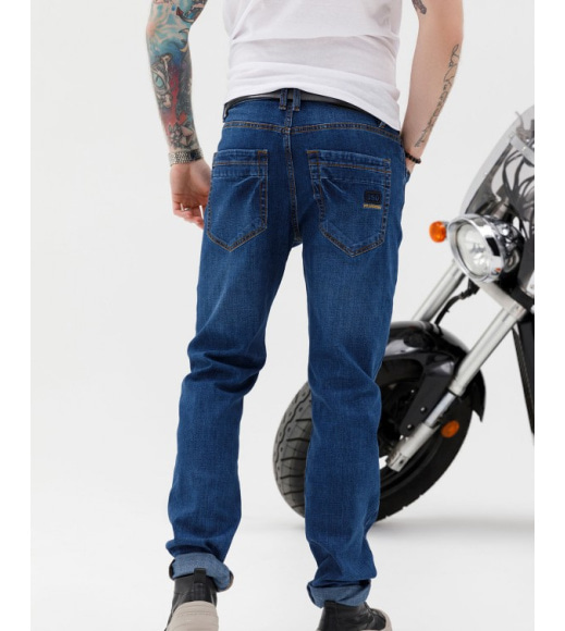 Сині класичні джинси з потертостями