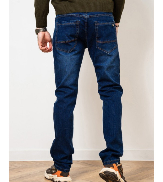 Сині джинси з легкими потертостями