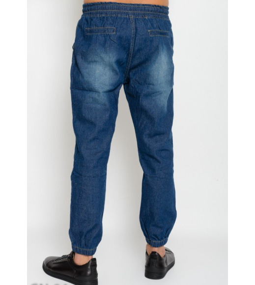 Синие джинсы на резинке с потертостями