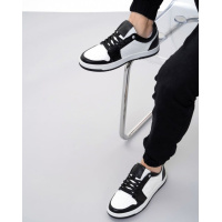 Бело-черные кожаные кеды с перфорацией