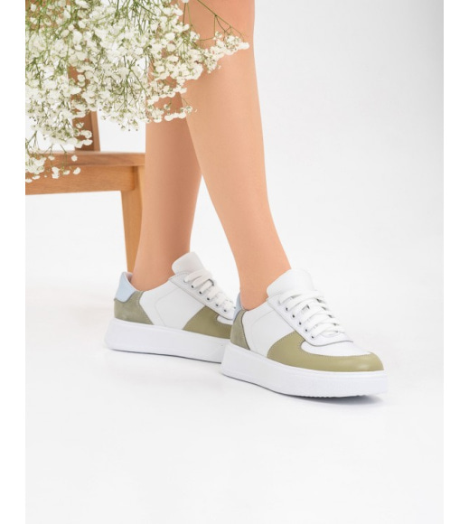 Білі шкіряні кросівки із зеленими вставками