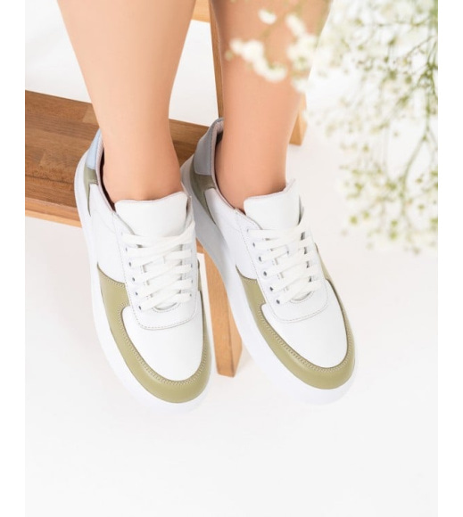 Білі шкіряні кросівки із зеленими вставками