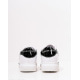 Белые кроссовки с лакированными черными листиками
