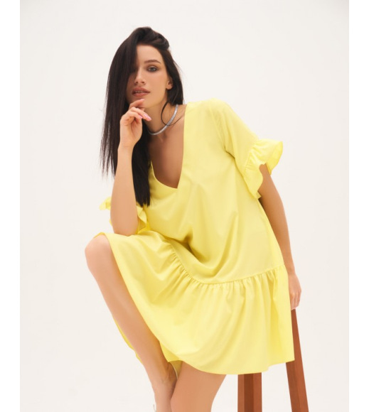 Жовта сукня-трапеція з воланами