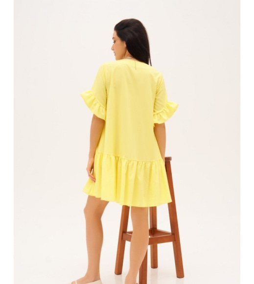 Жовта сукня-трапеція з воланами
