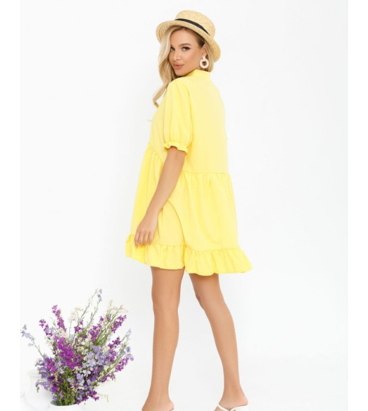 Жовта сукня-трапеція з рюшами і воланами