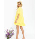Жовта сукня-трапеція з рюшами і воланами