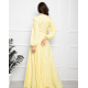 Жовте довге плаття з кроєм на запах