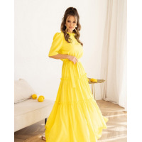 Жовта довга сукня з рюшами