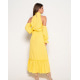 Жовта сукня з воланами і бічним розрізом