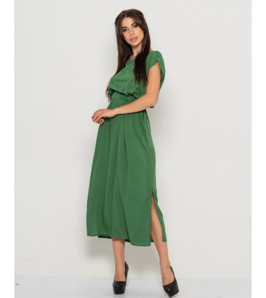 Зелена довга сукня з вирізом на спині