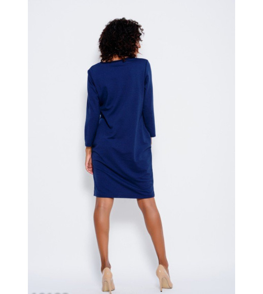 Темно-синє трикотажне плаття з довгими рукавами і кишенями
