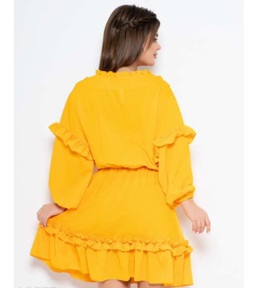Жовте плаття з рюшами і довгими рукавами