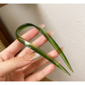 Зелена шпилька для волосся U-подібної форми