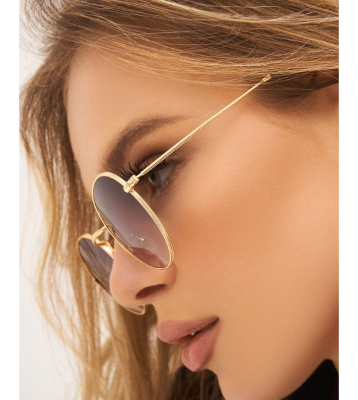 Золотистые солнцезащитные очки "панто"