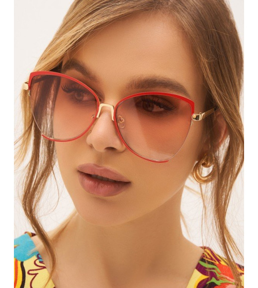 Сонцезахисні окуляри з червоною металевою оправою