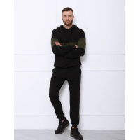 Черный трикотажный костюм с вставками