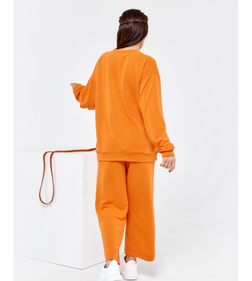 Оранжевий вільний костюм з трикотажу