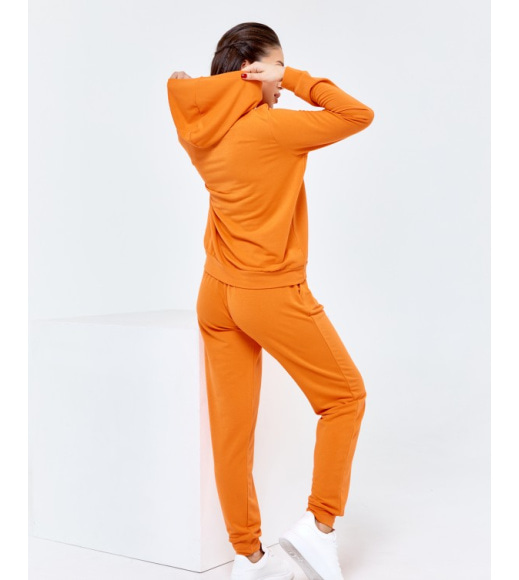 Оранжевый трикотажный спортивный костюм с капюшоном