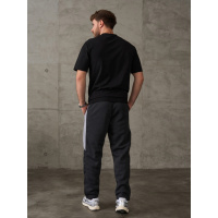 Темно-сірі штани, що утеплюють, з бічними вставками. Темно-сірі штани, що утеплюють, з бічними вставками.