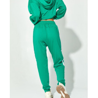 Зеленые трикотажные брюки с тесемками