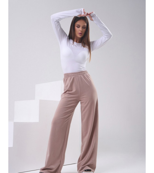 Бежевые трикотажные штаны с боковыми вставками