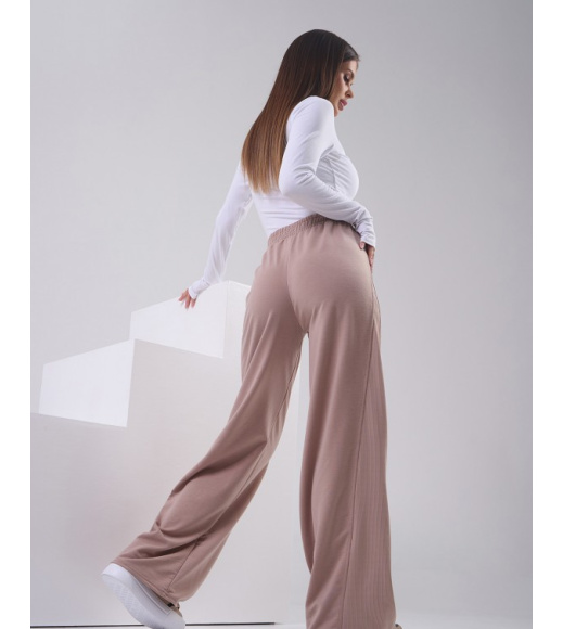 Бежевые трикотажные штаны с боковыми вставками