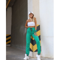 Зеленые трикотажные штаны с декором на манжетах