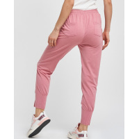Рожеві призібрані спортивні штани зі стрілками