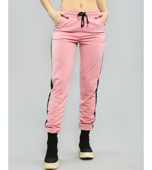 Розовые трикотажные штаны с лампасами