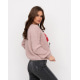 Рожевий об`ємний светр з яскравими нашивками