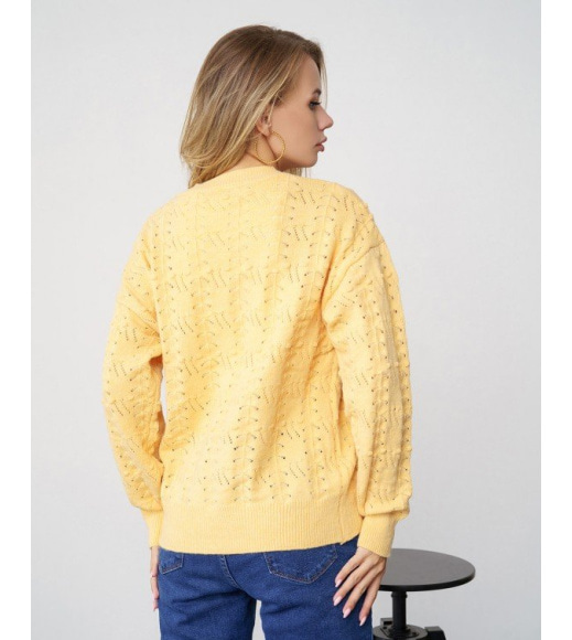 Жовтий светр ажурної в'язки