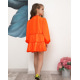 Неоново-помаранчеве плаття з рюшами і воланами